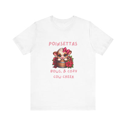 Cute Cow Poinsettia bows and cozy cow cheer Tee, Holiday Shirt, Cozy Unisex T-Shirt, Christmas Gift, Festive Apparel, Farm Animal Tee