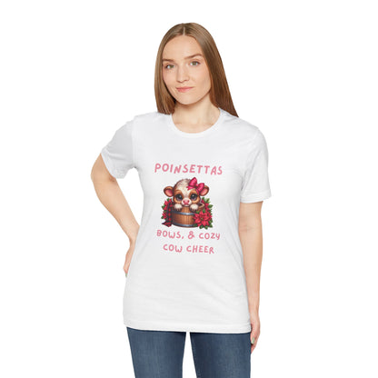 Cute Cow Poinsettia bows and cozy cow cheer Tee, Holiday Shirt, Cozy Unisex T-Shirt, Christmas Gift, Festive Apparel, Farm Animal Tee